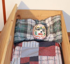 mask in coffin